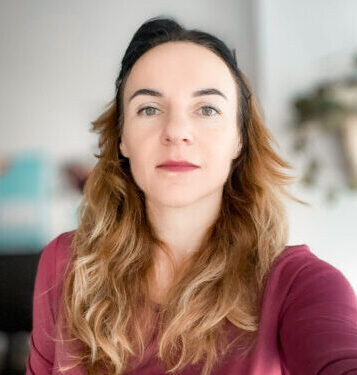 A portrait of Gabriela Gic-Grusza, the co-author of the ESG Whitepaper